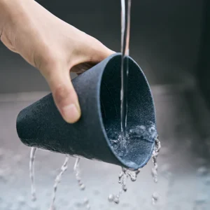 Hand rinsing the Cerapotta ceramic coffee filter under water to clean after use