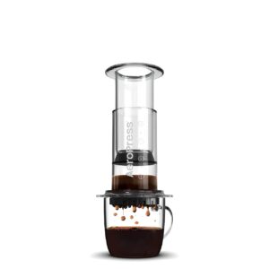 Clear AeroPress coffee maker showcasing a clean brewing process.