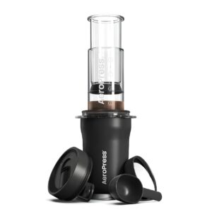 Black Aeropress Go Plus Travel Coffee Maker with complete accessories for portable brewing.